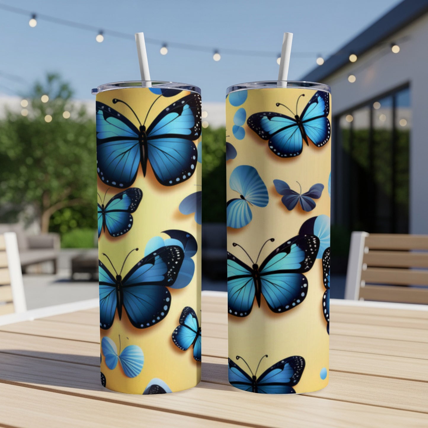 Two yellow tumblers adorned with blue butterflies and flower motifs.