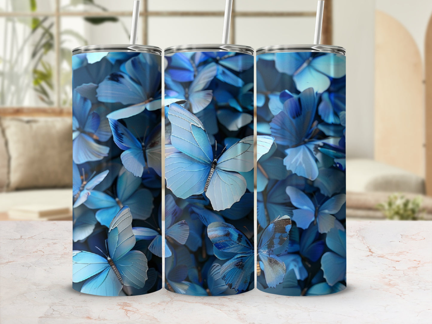 Three tumblers with blue butterfly pattern.