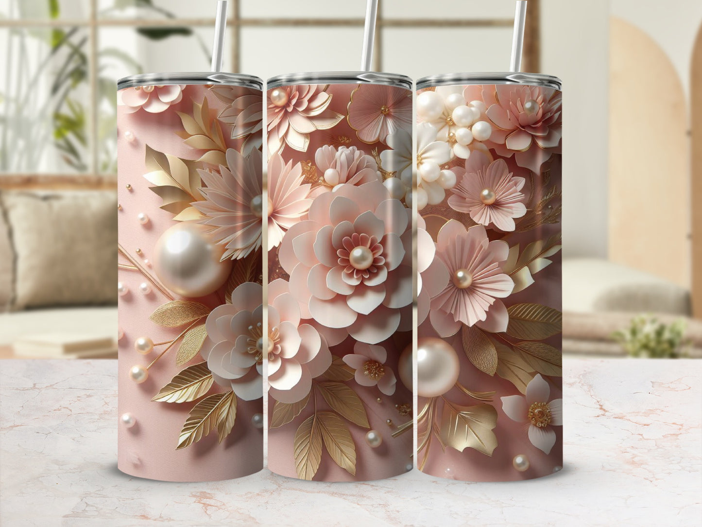 Three pink tumblers adorned with delicate pearl and gold floral designs.