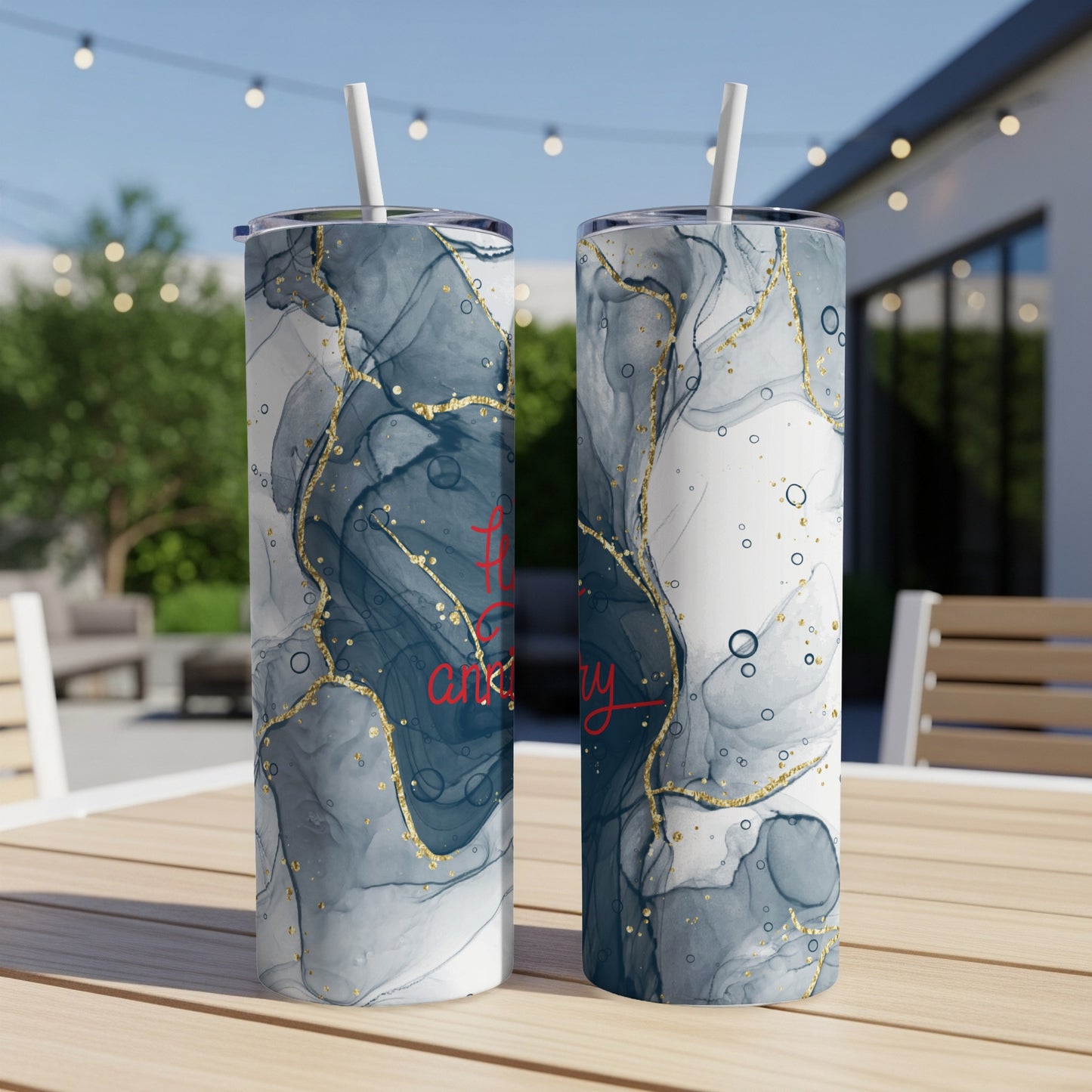 Two tumblers with blue and gold marble design, one with red text.