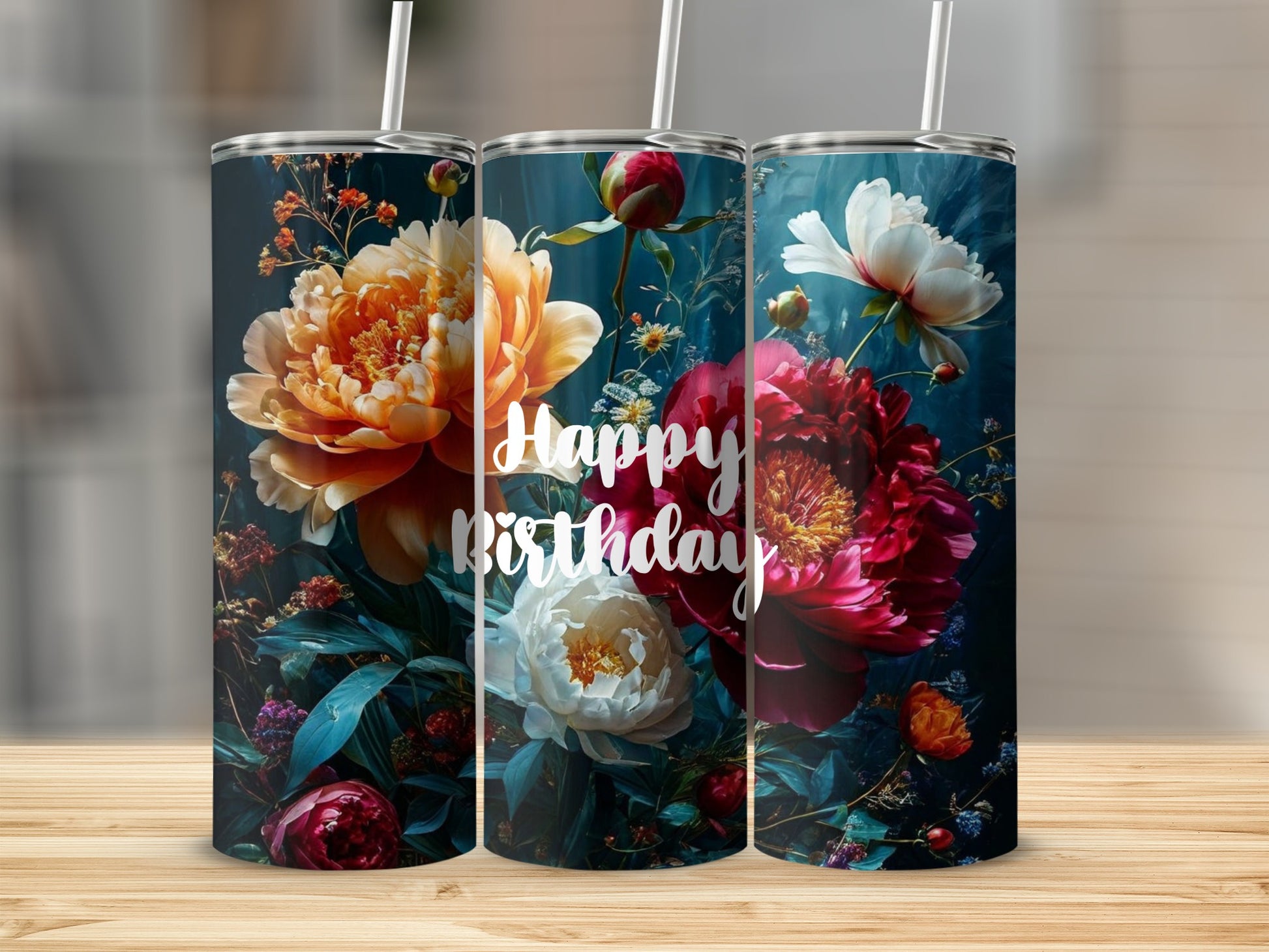 Floral tumbler with "Happy Birthday" text on a wooden surface.