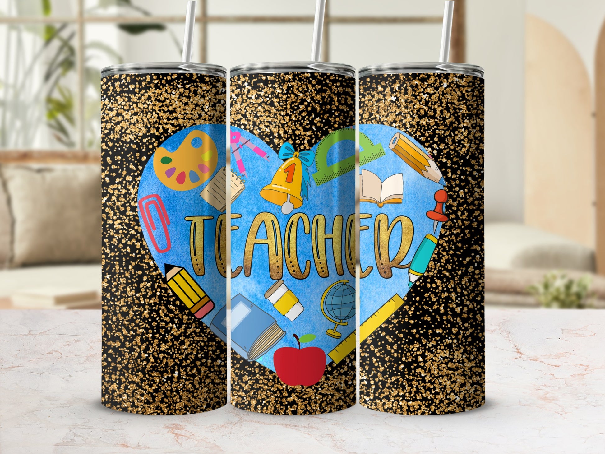Teacher heart tumbler with school supplies and gold glitter.