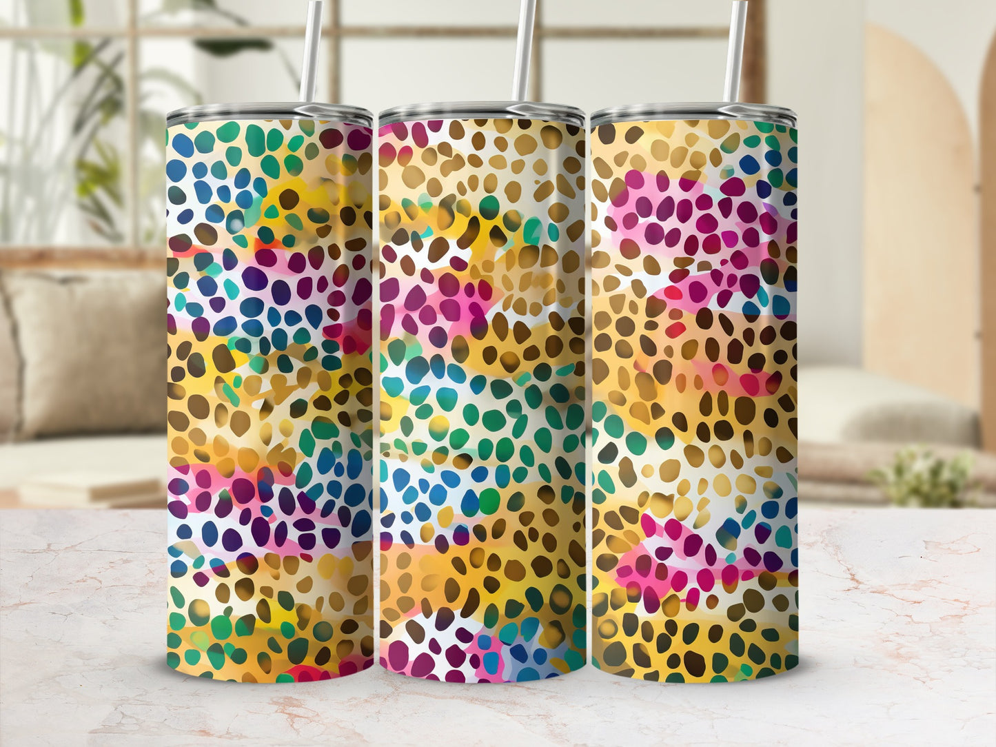 Triptych of tumblers with a colorful, abstract spotted pattern.