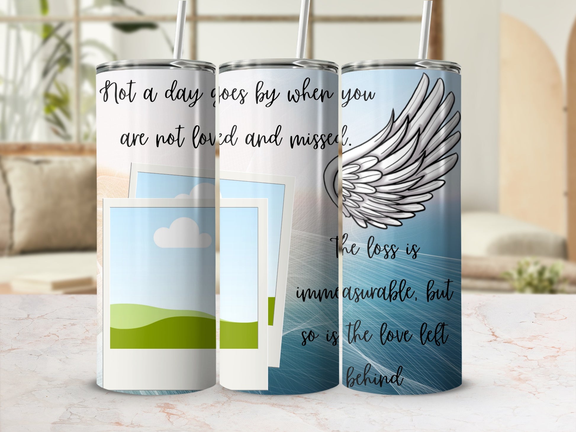 Three tumblers with memorial quotes and angel wings.