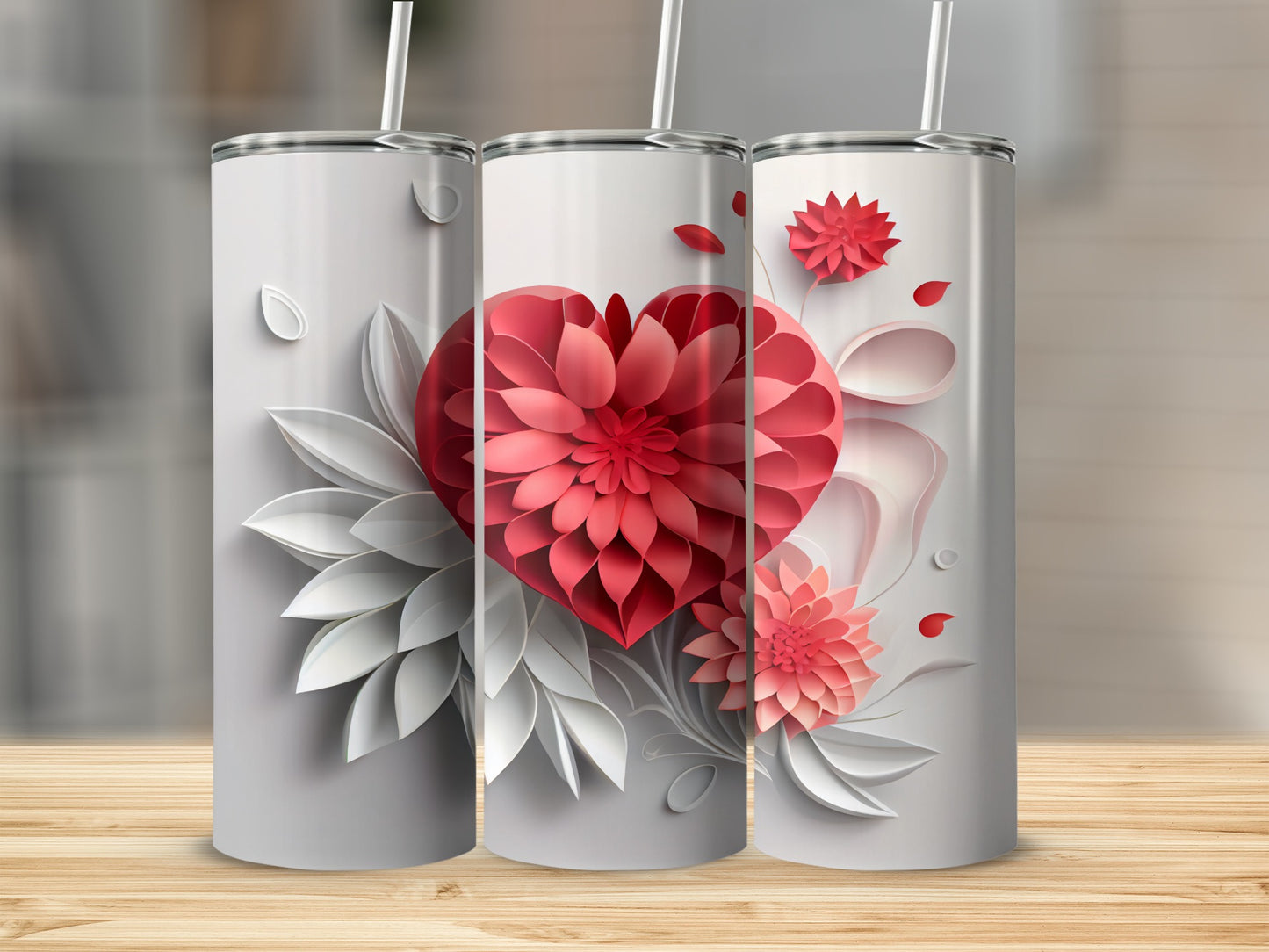 Three white tumblers with a red floral heart design and white accents.