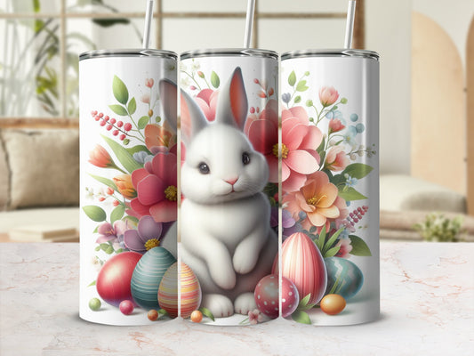 White bunny surrounded by colorful Easter eggs and flowers.