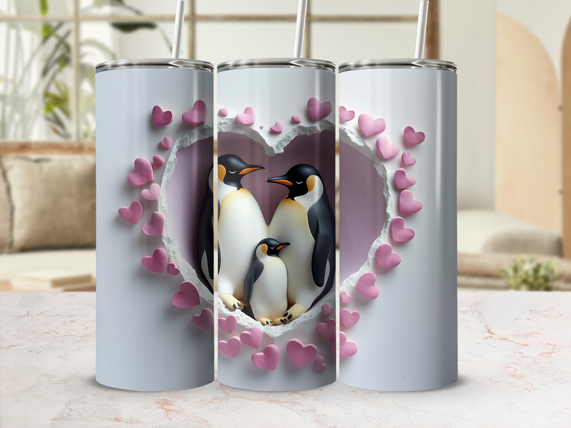 Three stainless steel tumblers with a heart-shaped design featuring penguins.