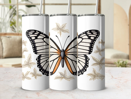 White tumbler with large butterfly and leaf pattern.