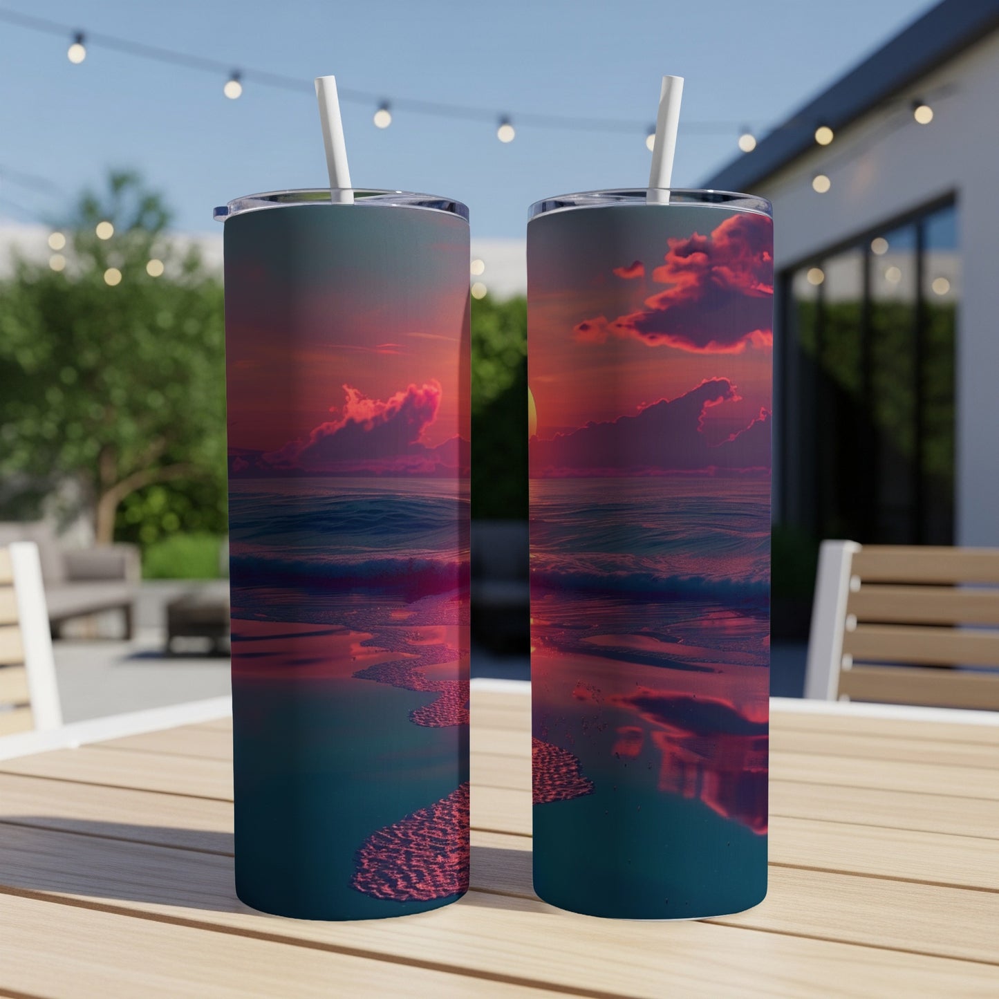 Two tumblers displaying a vibrant sunset over the ocean.