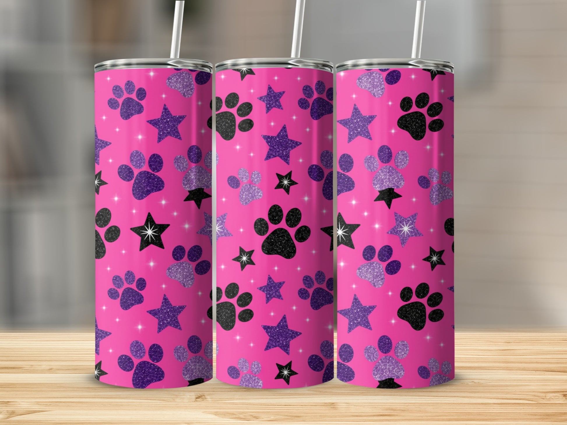 Three pink tumblers with black and glitter paw prints and stars.
