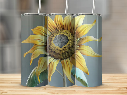 Three tumblers feature a realistic sunflower design against a blurred gray background.