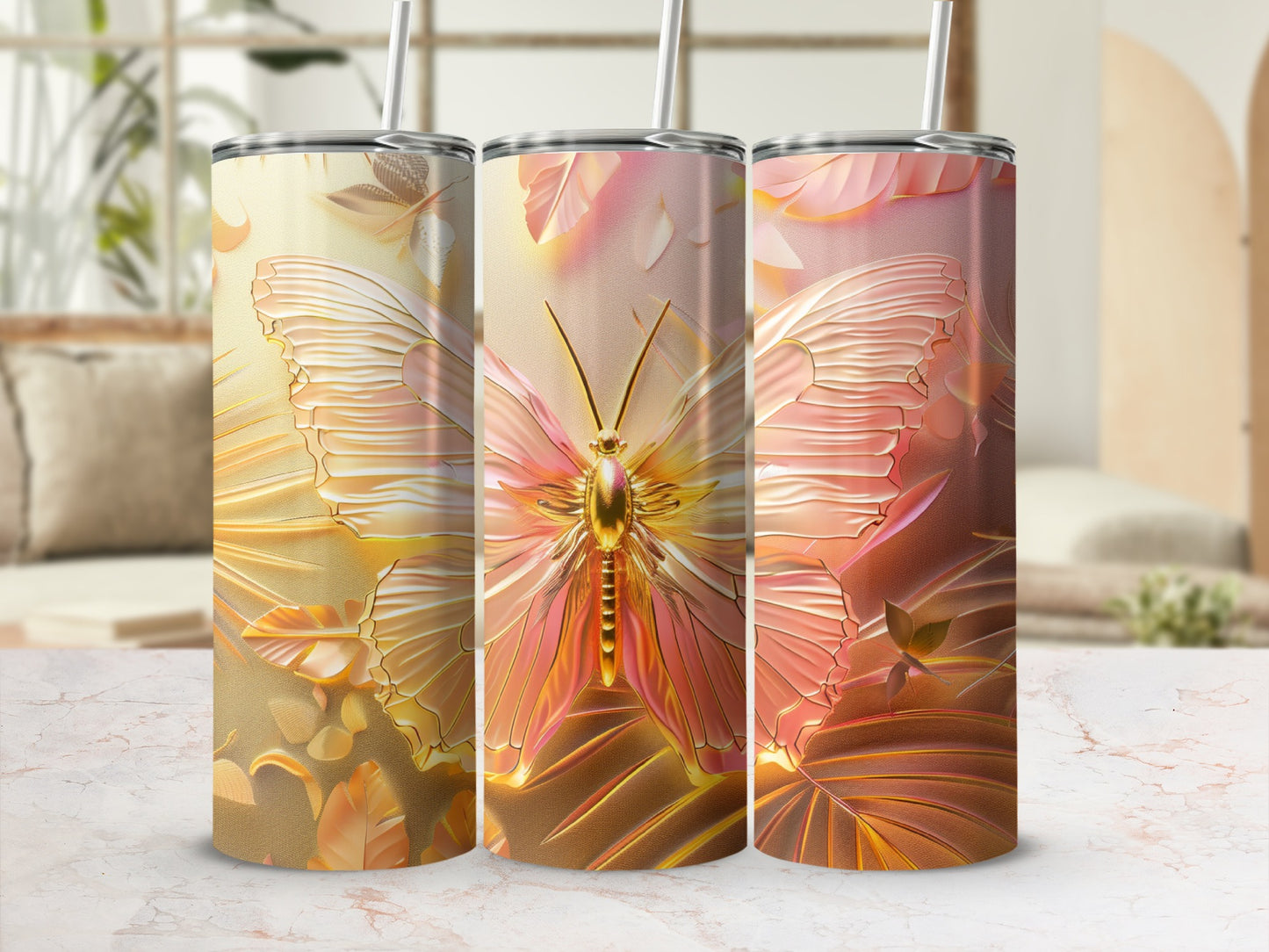 Three tumblers with a shimmering golden butterfly and floral pattern.