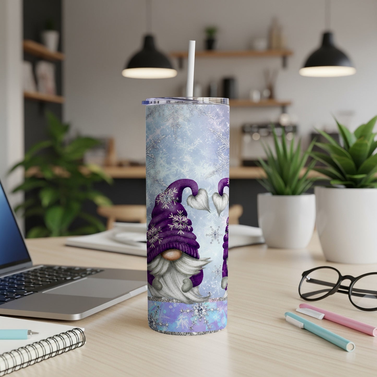 Purple gnome pattern tumbler with snowflakes and a straw.