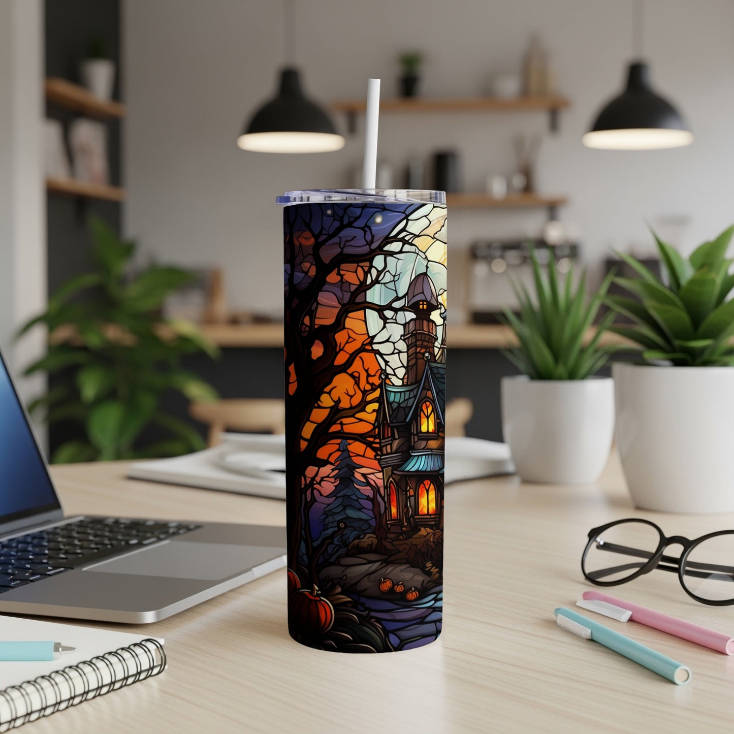 Halloween-themed tumbler with haunted house, pumpkin, and moon scene.