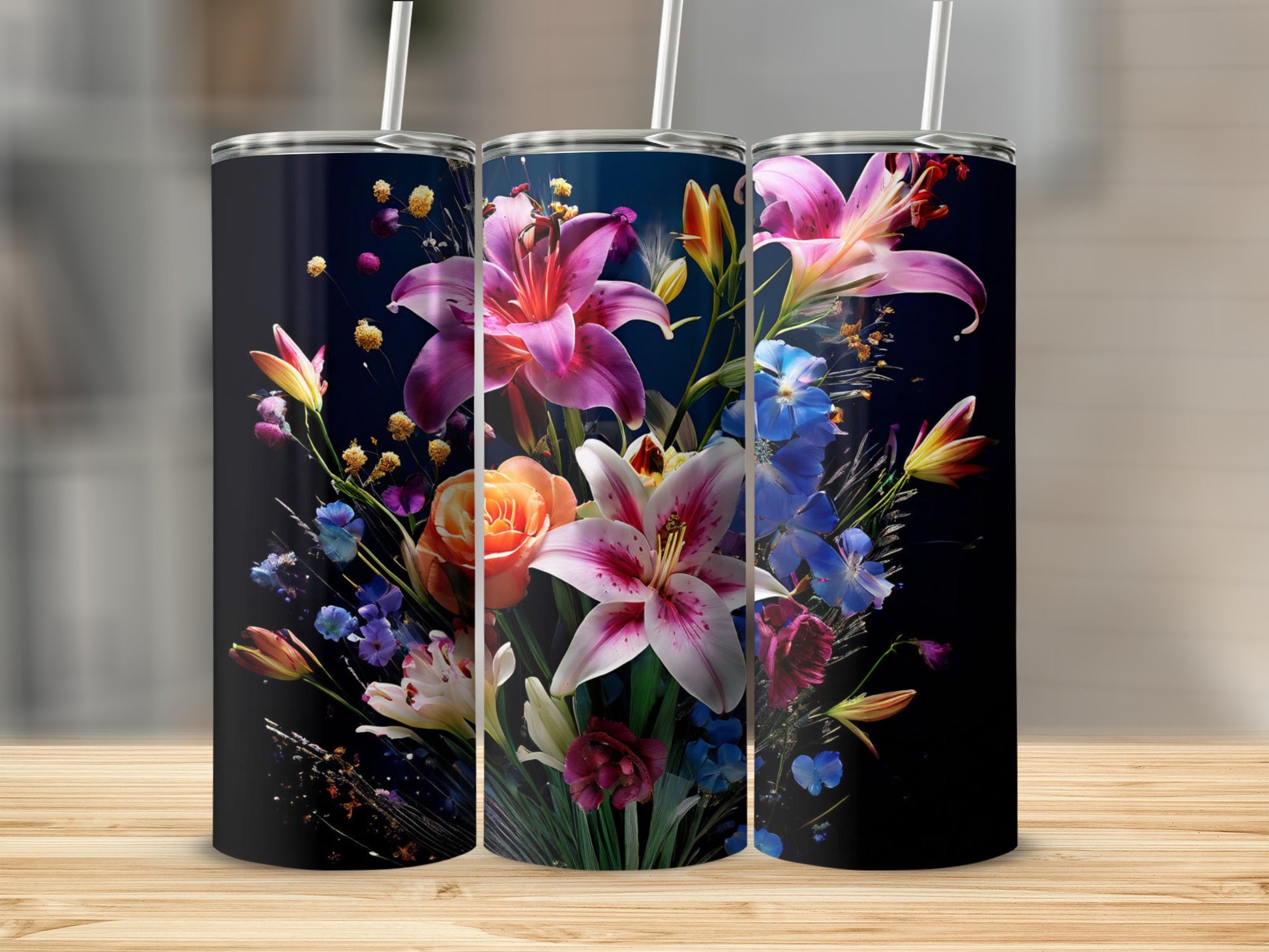 Three tumblers featuring a vibrant floral arrangement on a dark background.