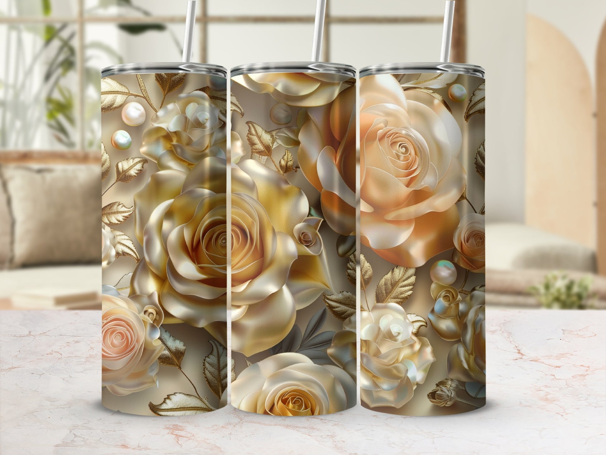 Three tall tumblers with golden rose floral designs and pearls.
