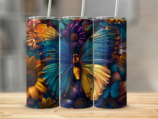 Three tumblers with colorful butterfly and floral designs on a wooden surface.