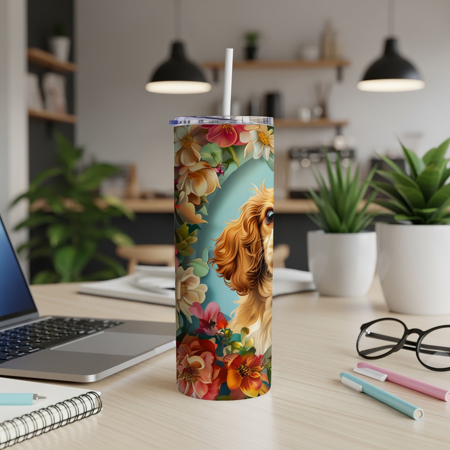 Cavalier King Charles Spaniel with floral accents on a reusable tumbler.