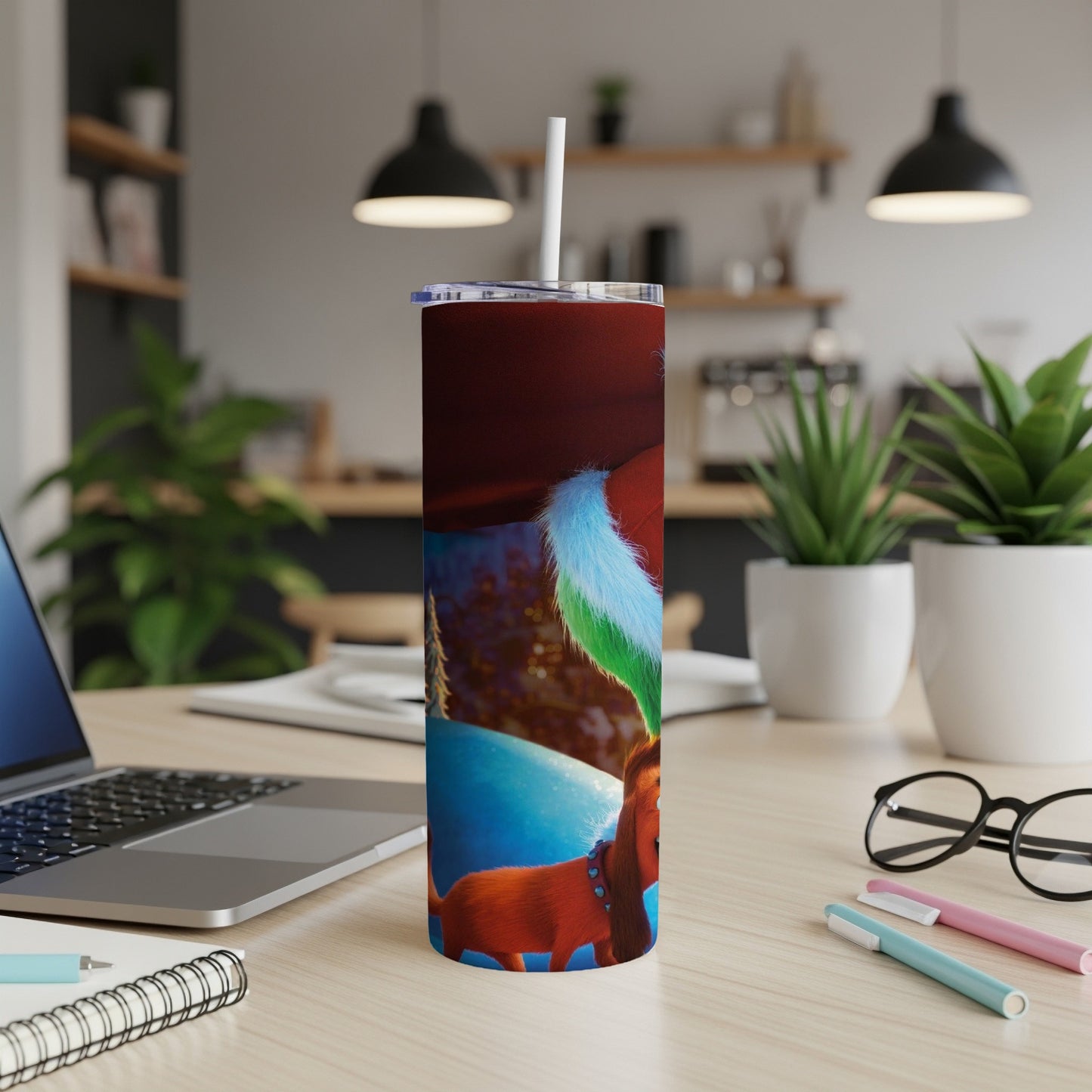 Brown dog wearing Santa hat, on a skinny tumbler with straw.