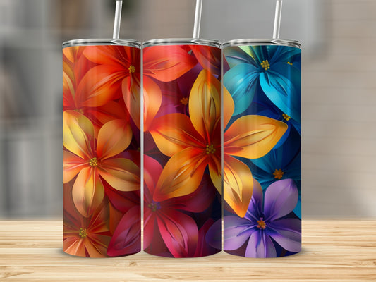 Three floral tumblers: red-orange, purple-blue, and blue-purple, on a wooden surface.