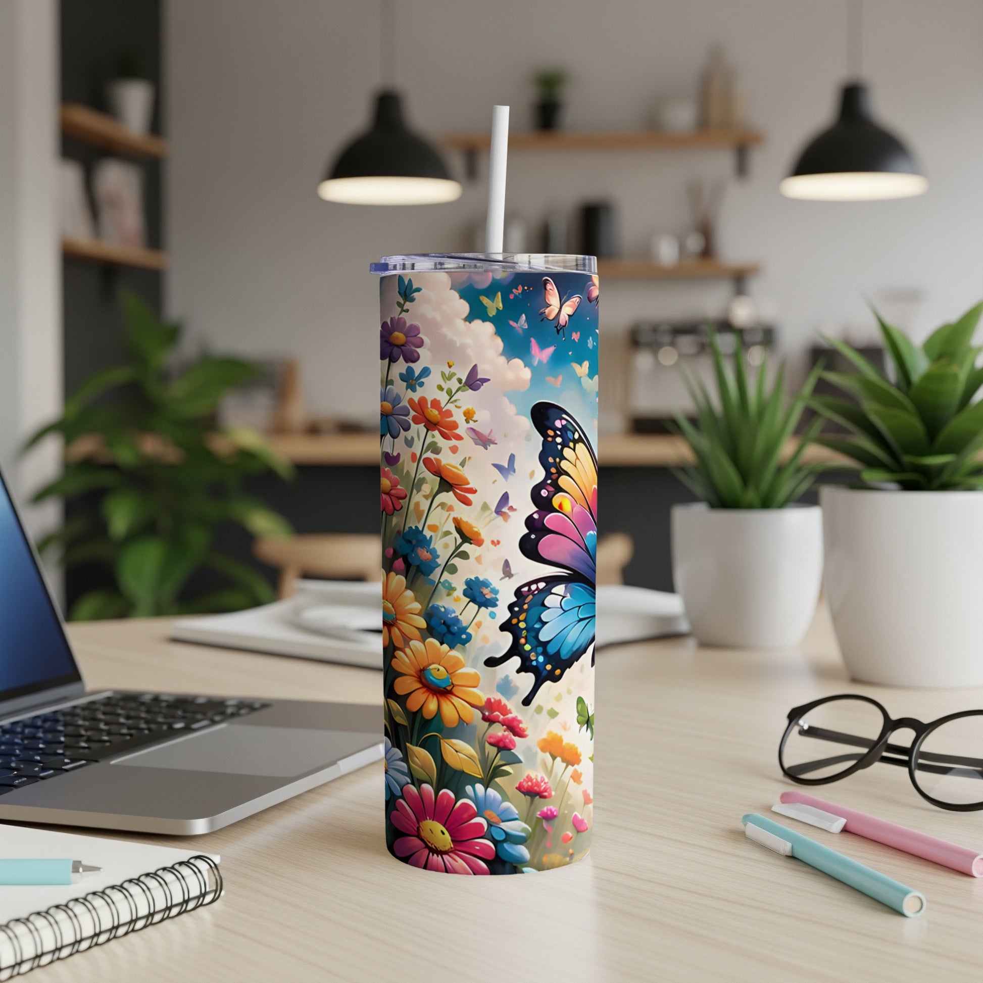 Tall tumbler with a colorful butterfly and floral design.