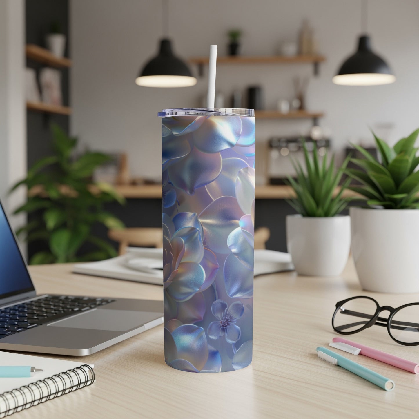 Iridescent succulent floral pattern on a reusable tumbler with a straw.