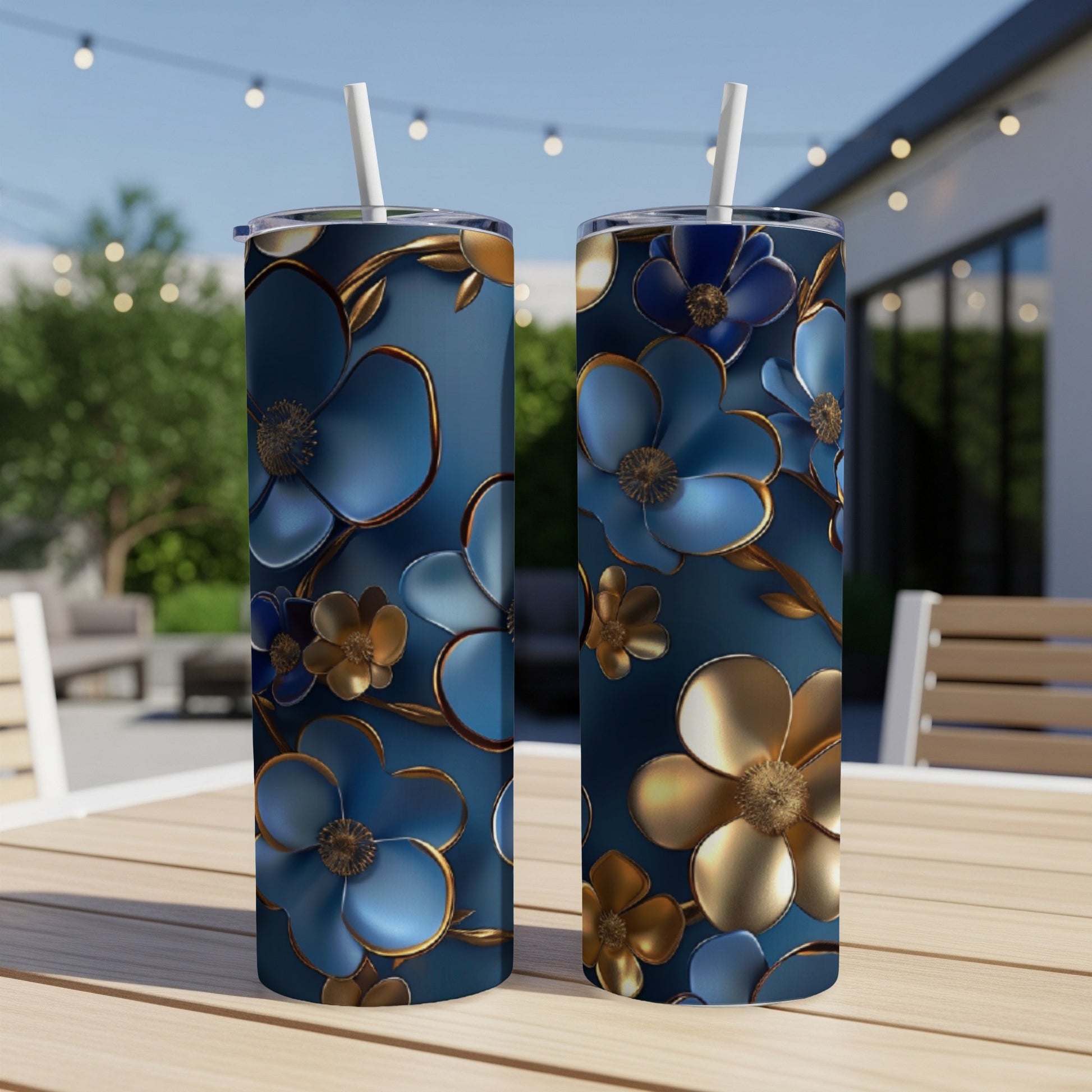 Two tall, slim tumblers with blue and gold floral pattern.
