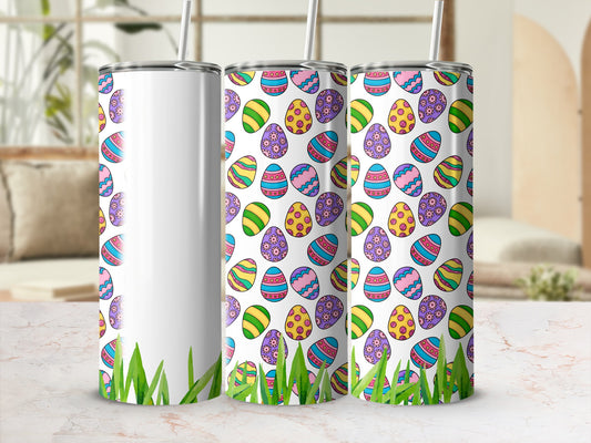 Three tumblers with colorful Easter egg pattern and green grass base.