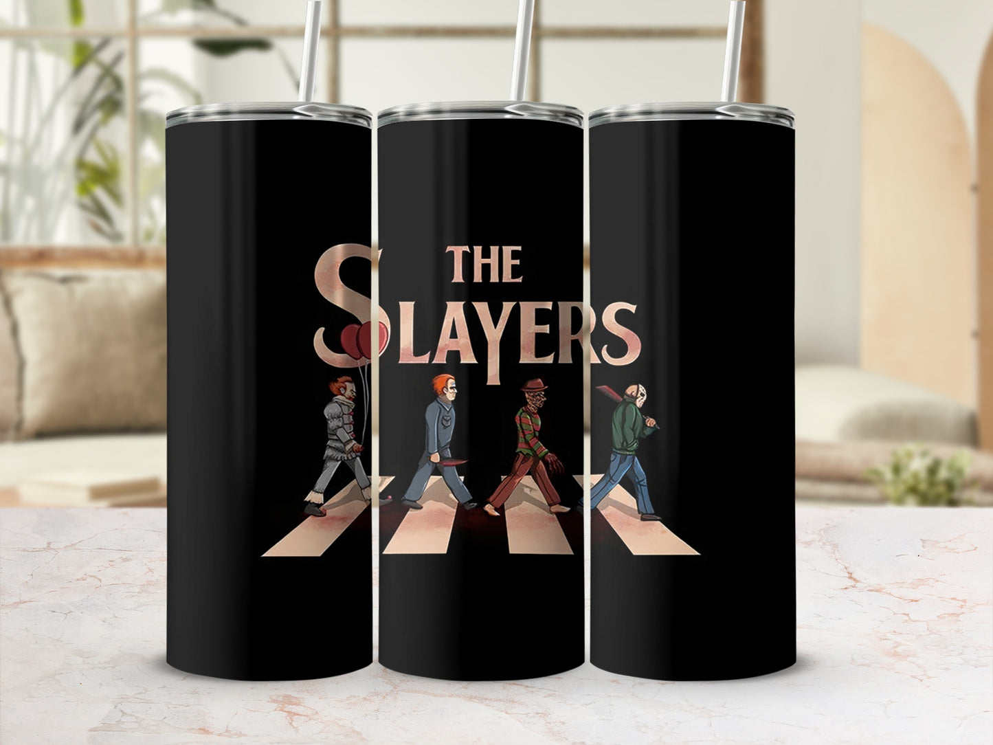 "The Slayers" text and horror characters walking on Abbey Road on black tumblers.