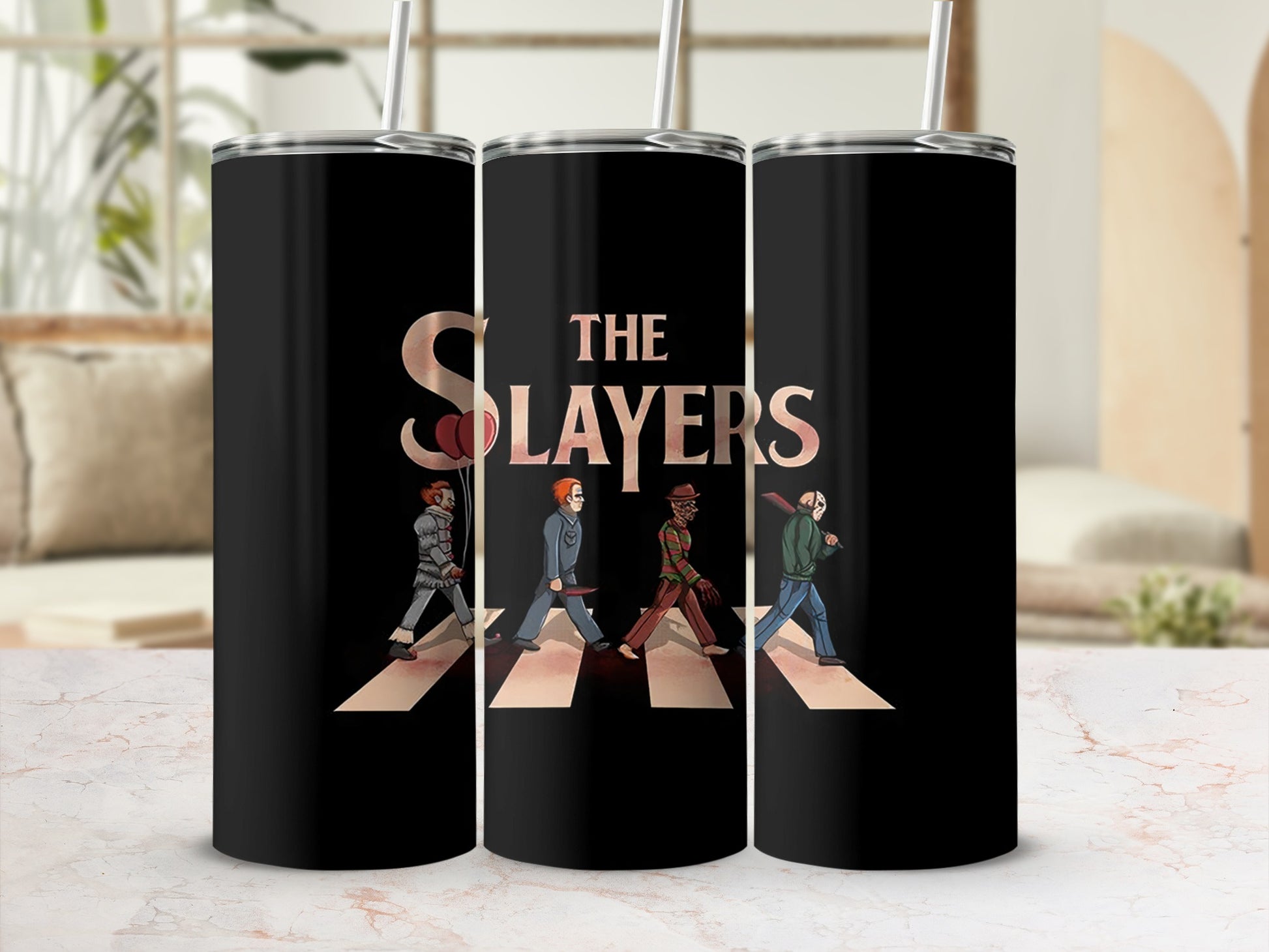 "The Slayers" text and horror characters walking on Abbey Road on black tumblers.