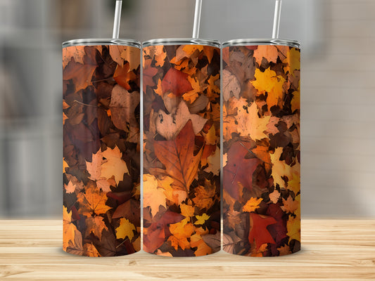 Three tumblers with a pattern of colorful autumn leaves.