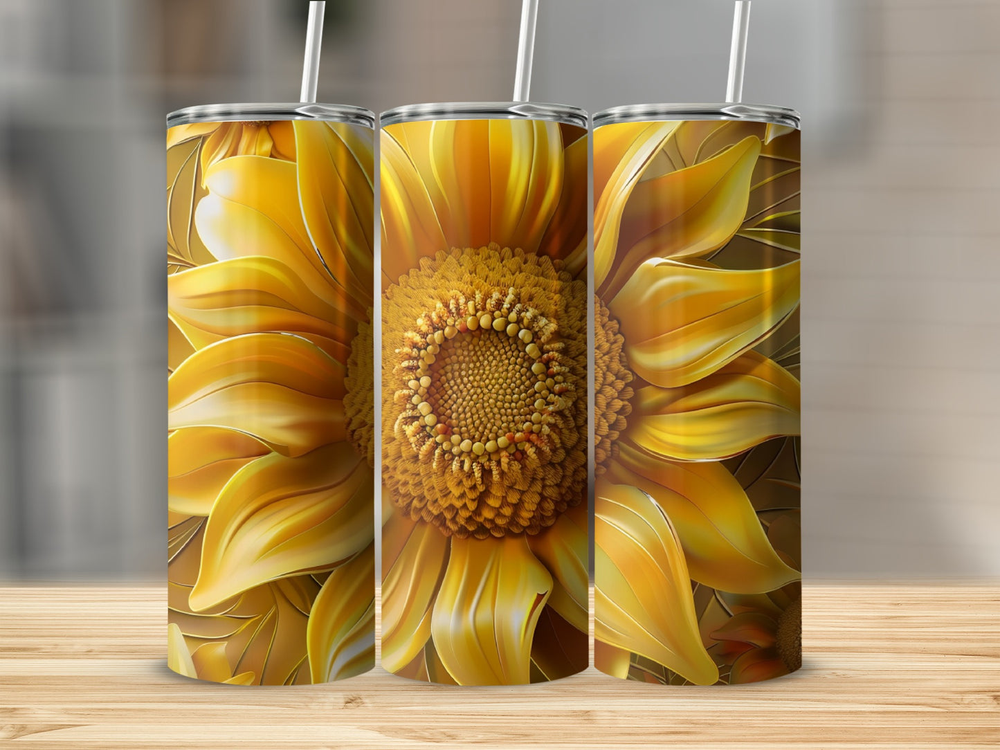 Three tumblers with large yellow sunflower art on a wooden surface.