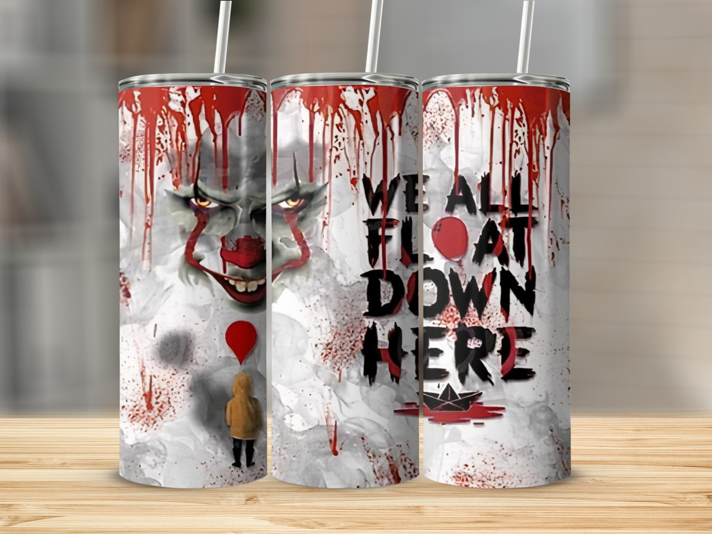 Tumbler with Pennywise from IT and the text "We all float down here."