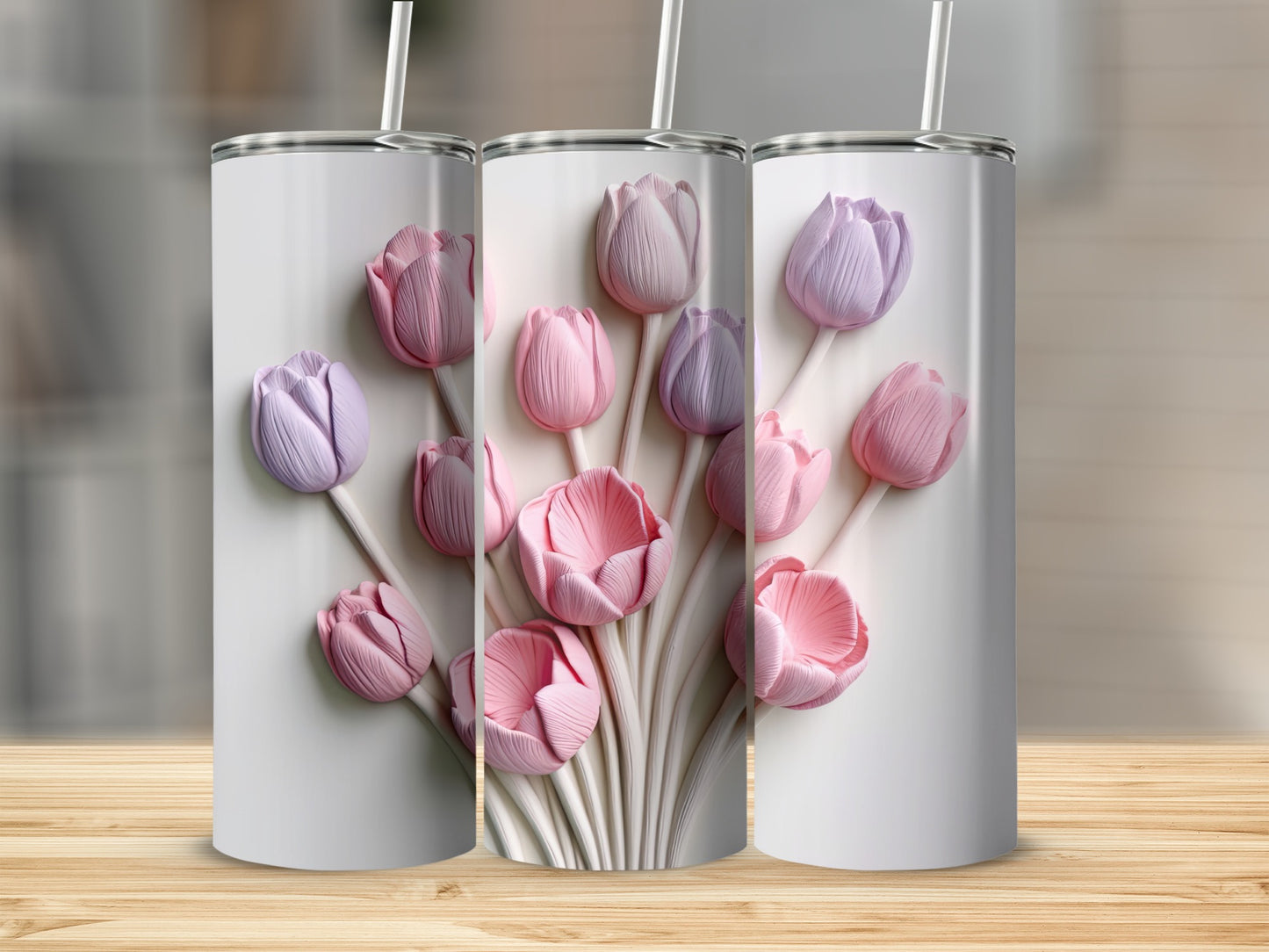 Three tumblers adorned with embossed pink and purple tulips.