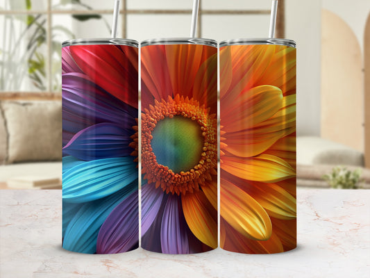 Three colorful tumblers with floral petal designs, each featuring a straw.