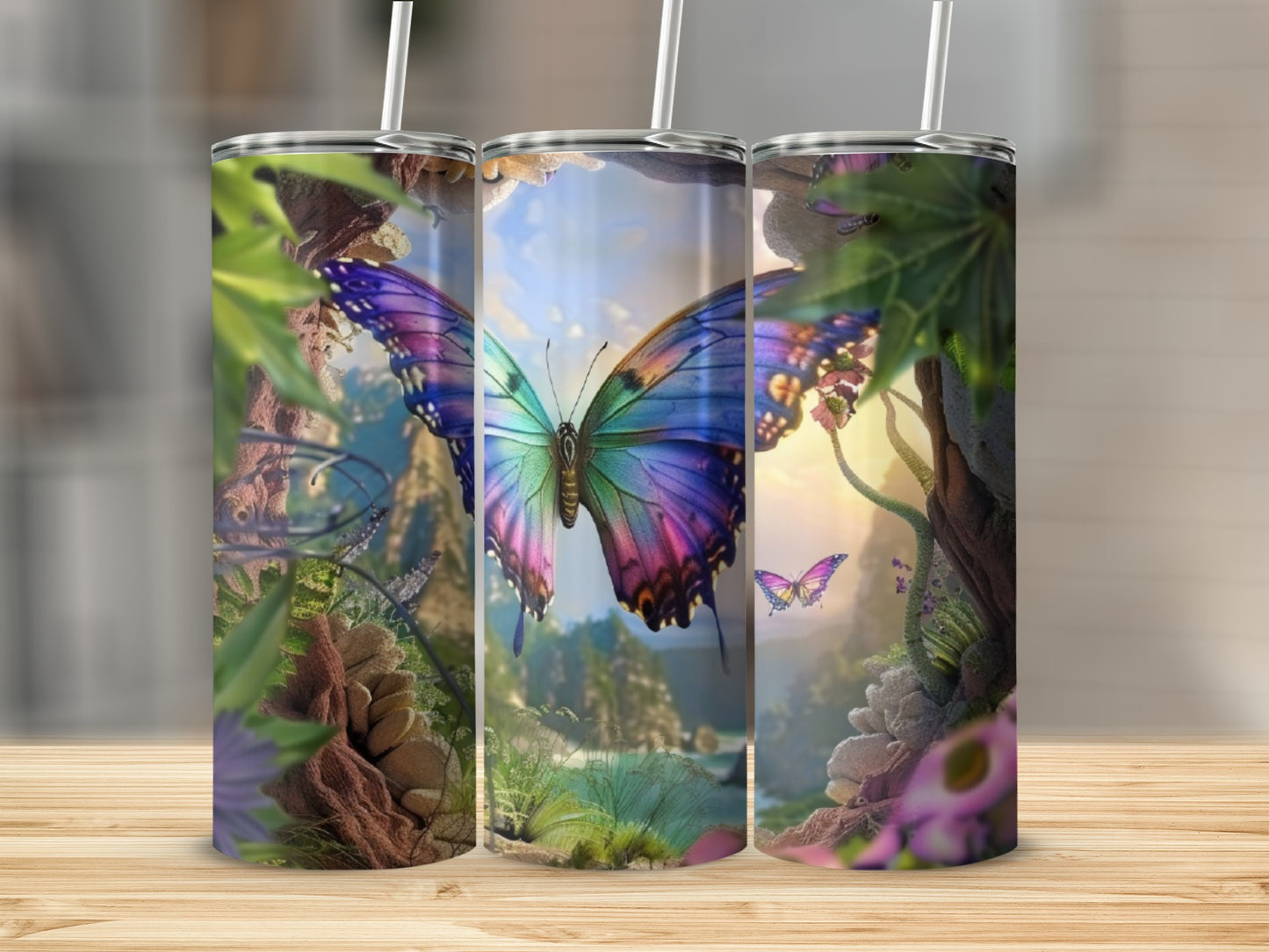 Butterfly and nature scene on three tumblers.