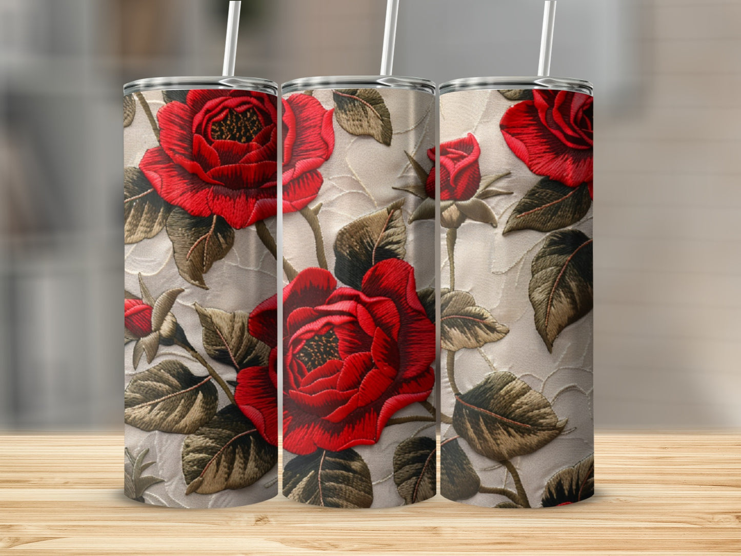 Three tumblers with a red rose embroidery pattern.