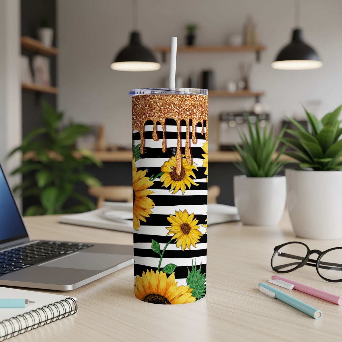 Black and white striped tumbler with sunflowers and glitter gold drip.