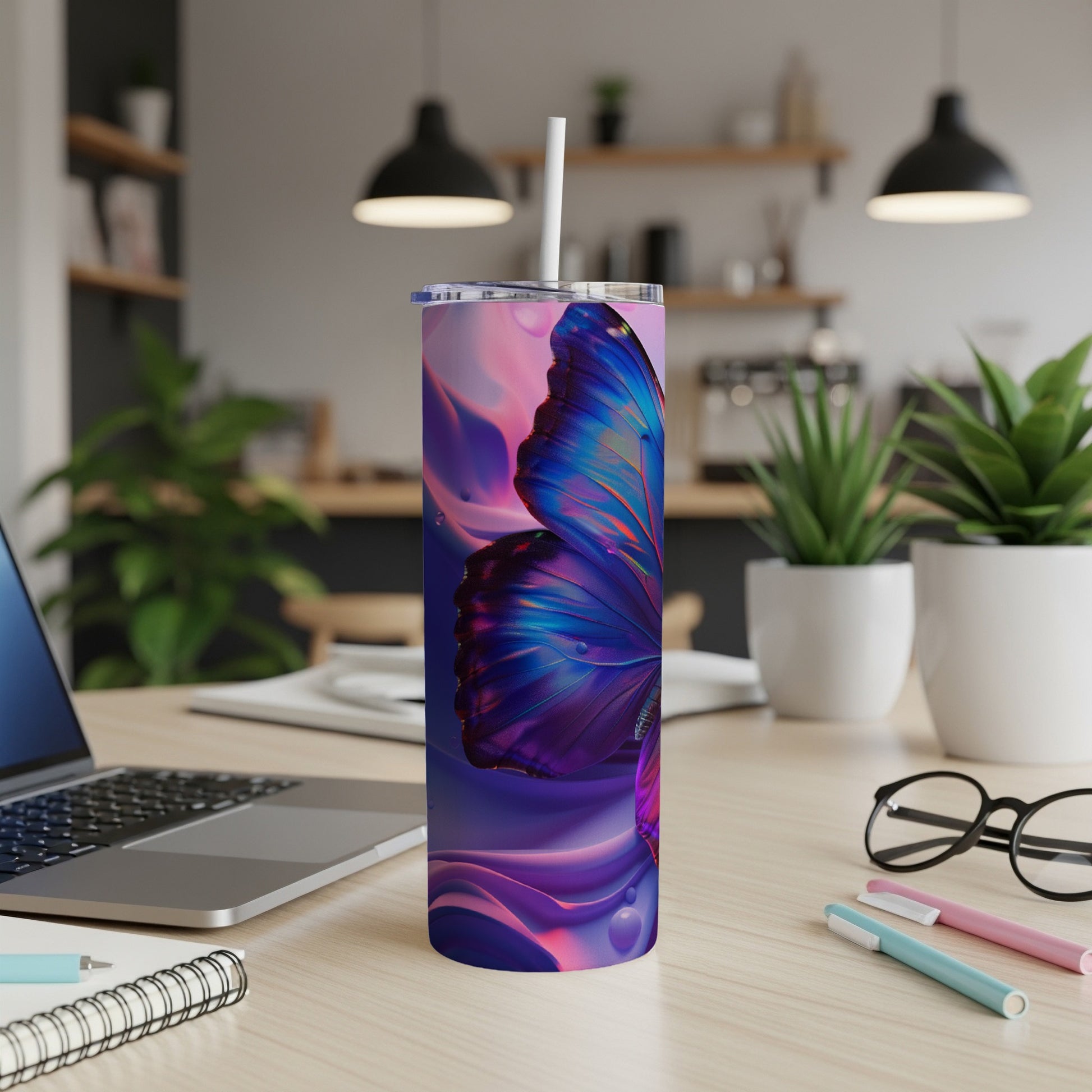 Purple and blue butterfly on a tall tumbler with a straw.