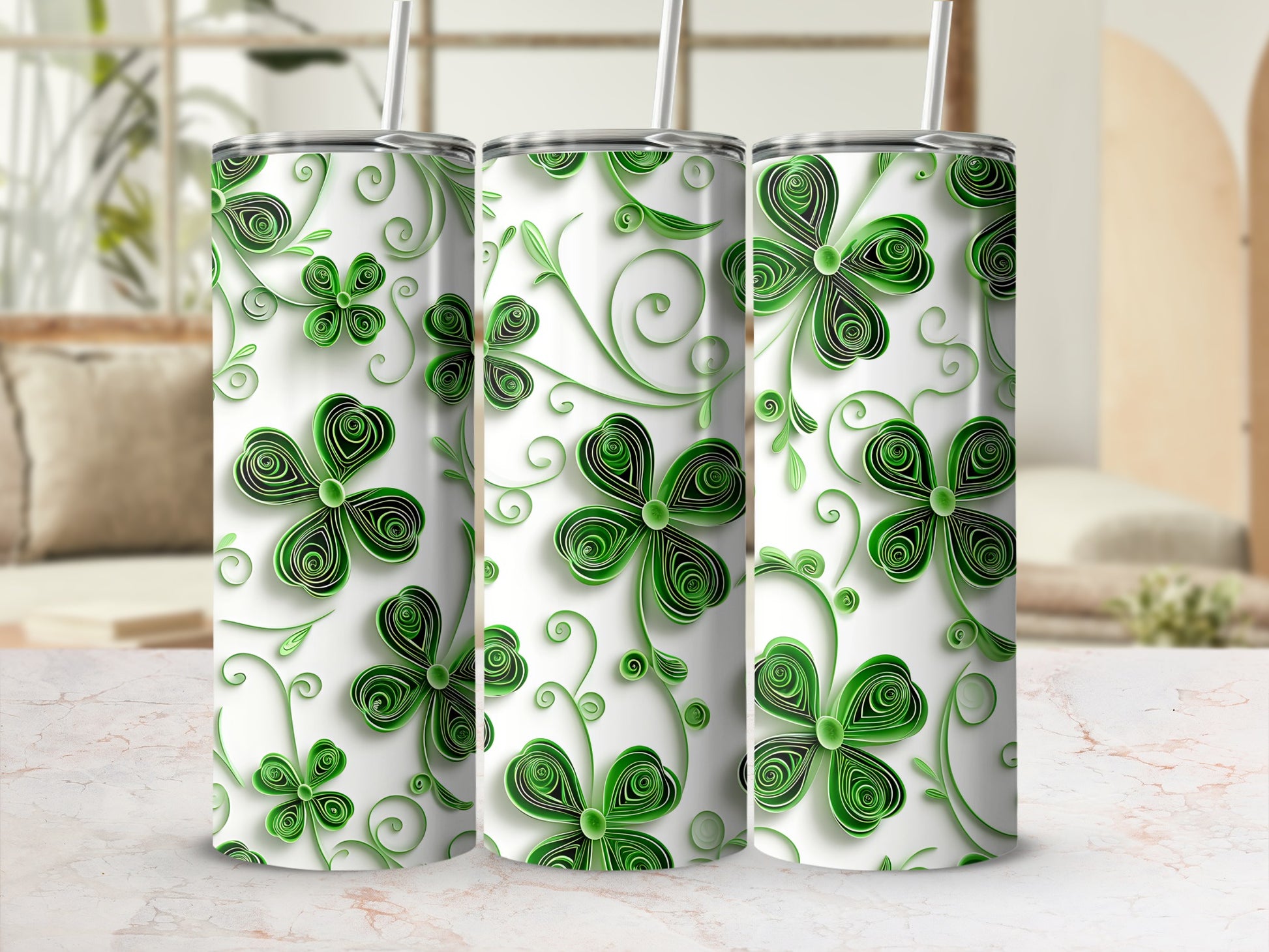 Three green shamrock tumblers with swirling vine patterns.
