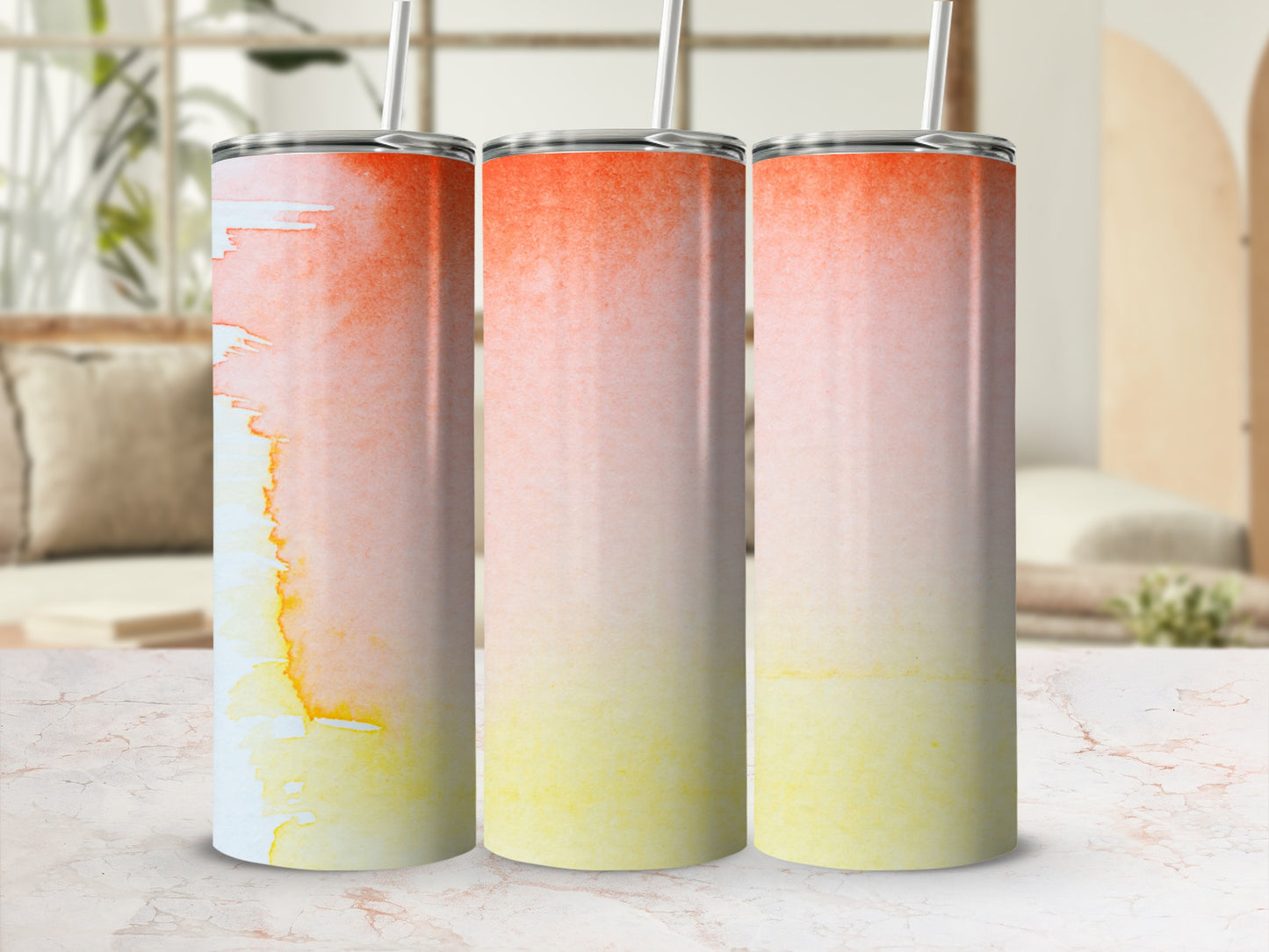 Three tumblers with a watercolor gradient of yellow, orange, and white.