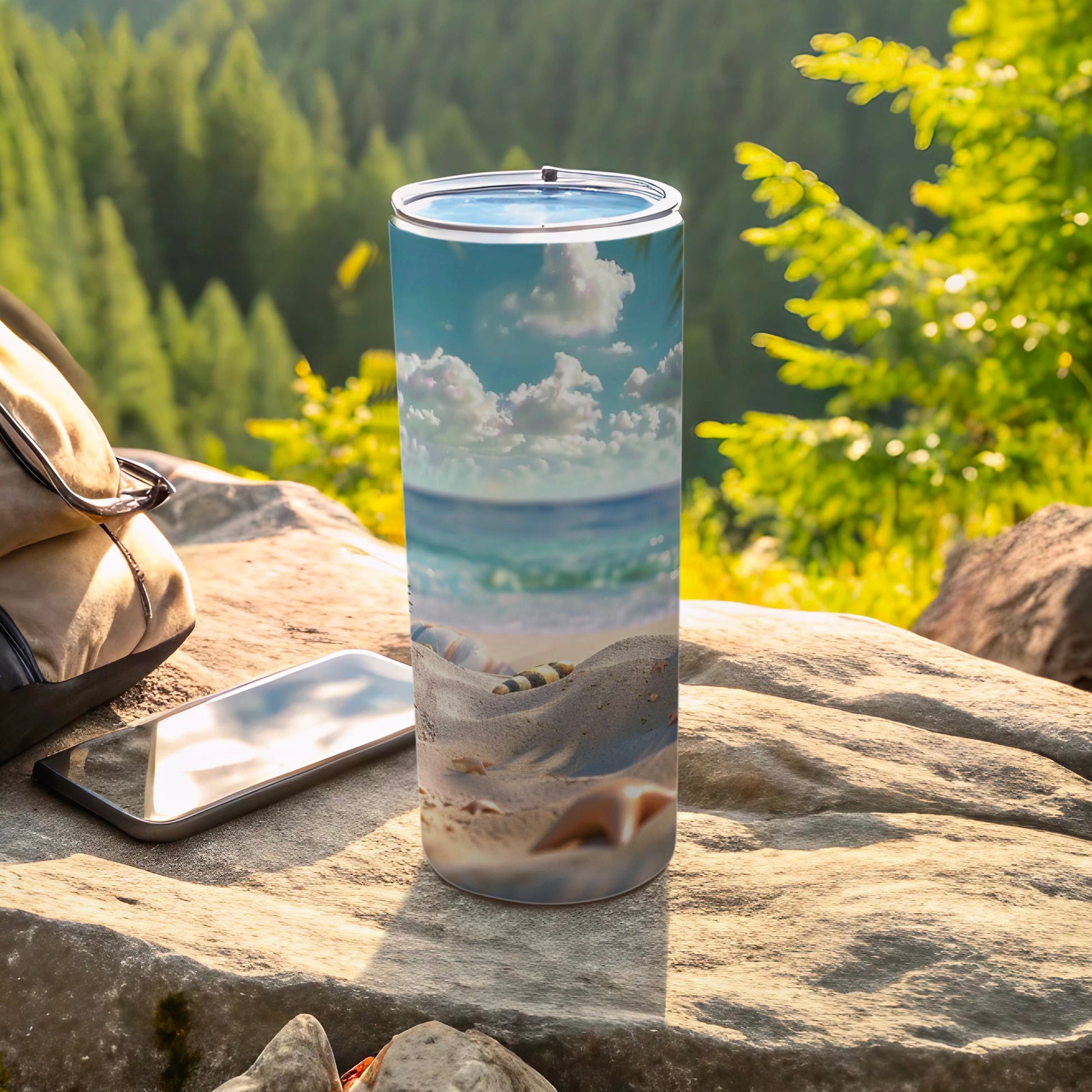 Beach scene tumbler with sandy shore and ocean under blue sky.