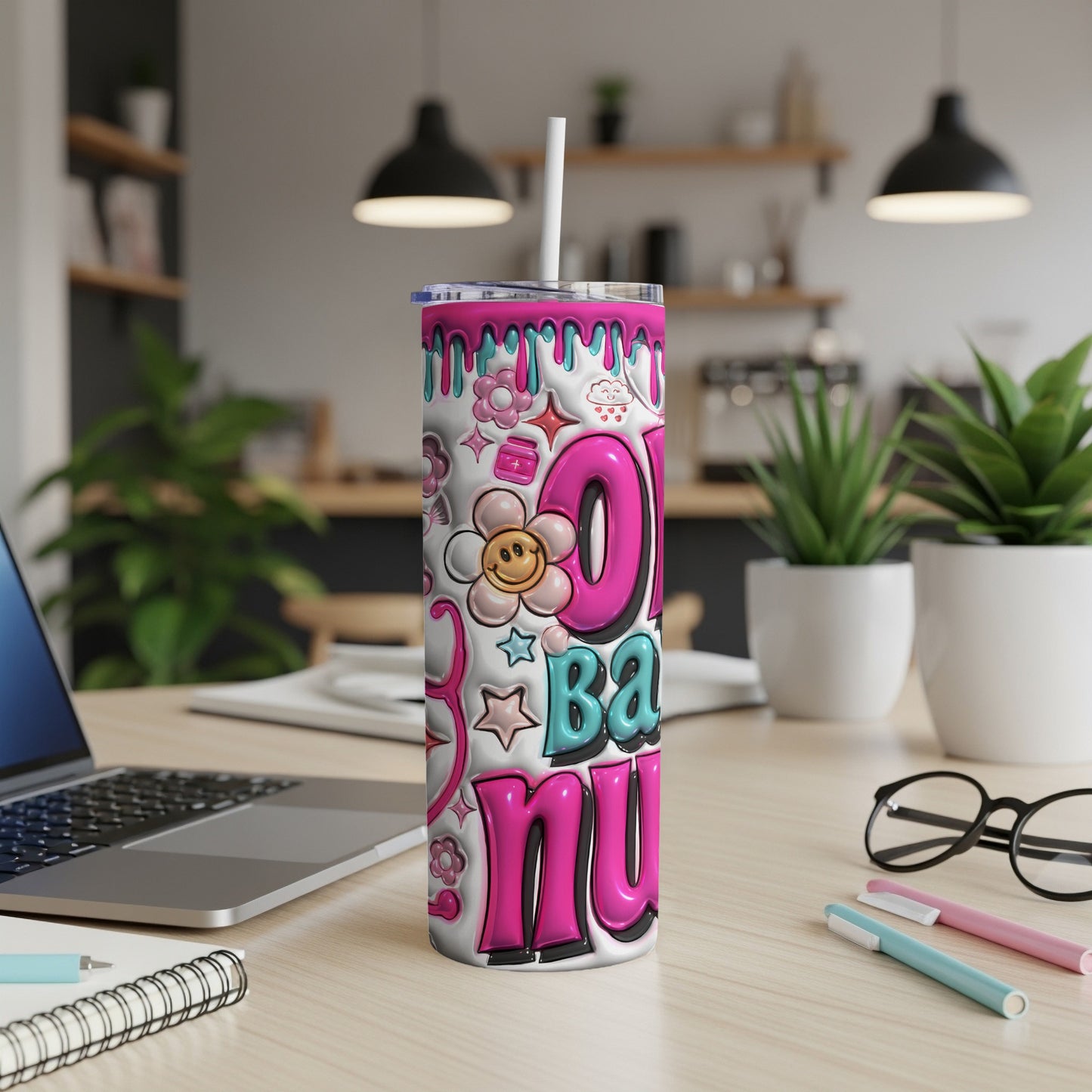 Pink tumbler with "0-100 Baby Nurse" text and playful graphic elements.