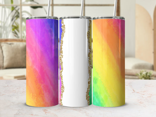 Three tumblers with rainbow watercolor designs and gold glitter accents.