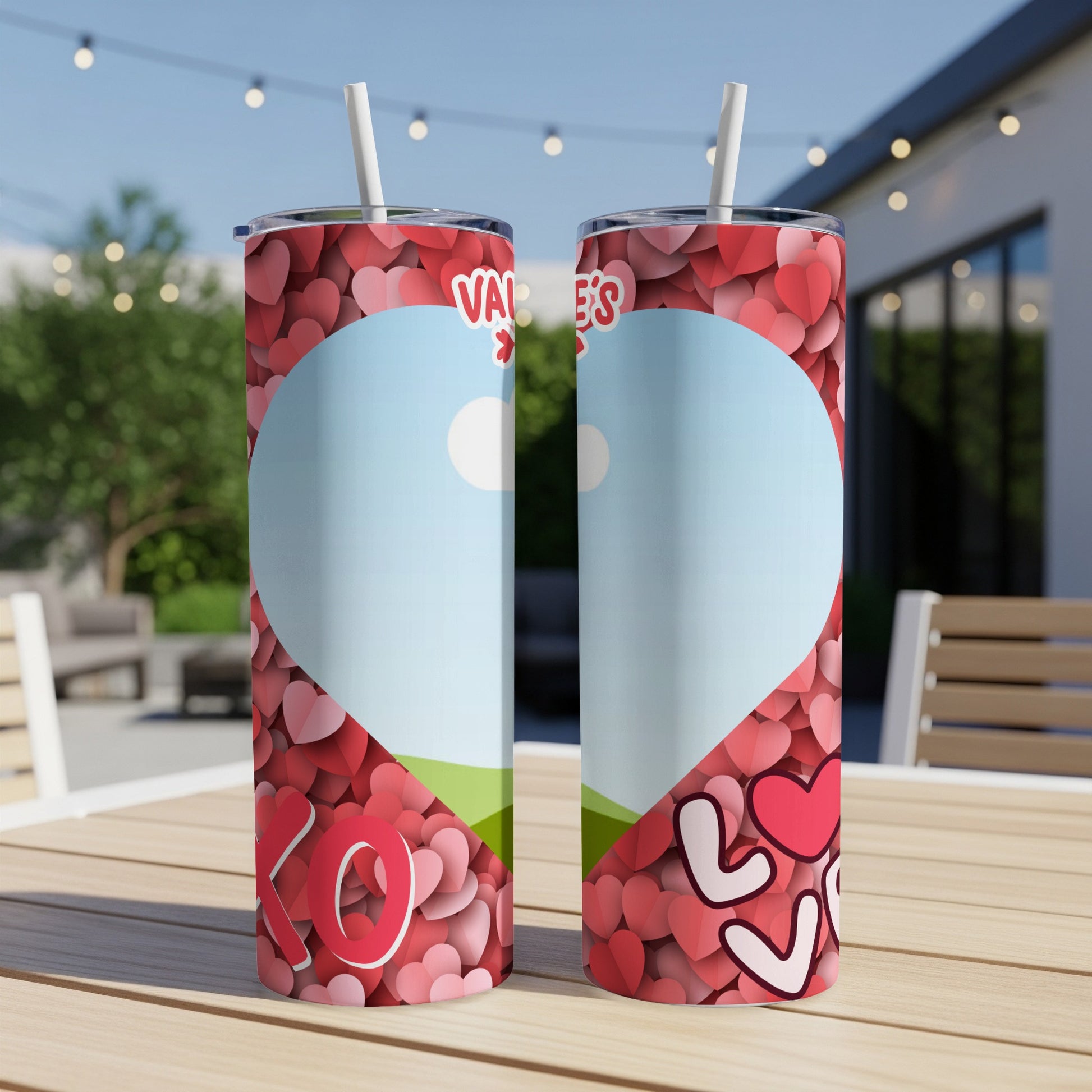 Valentine's Day tumblers with hearts, "XO" and "LOVE" text, on a table.