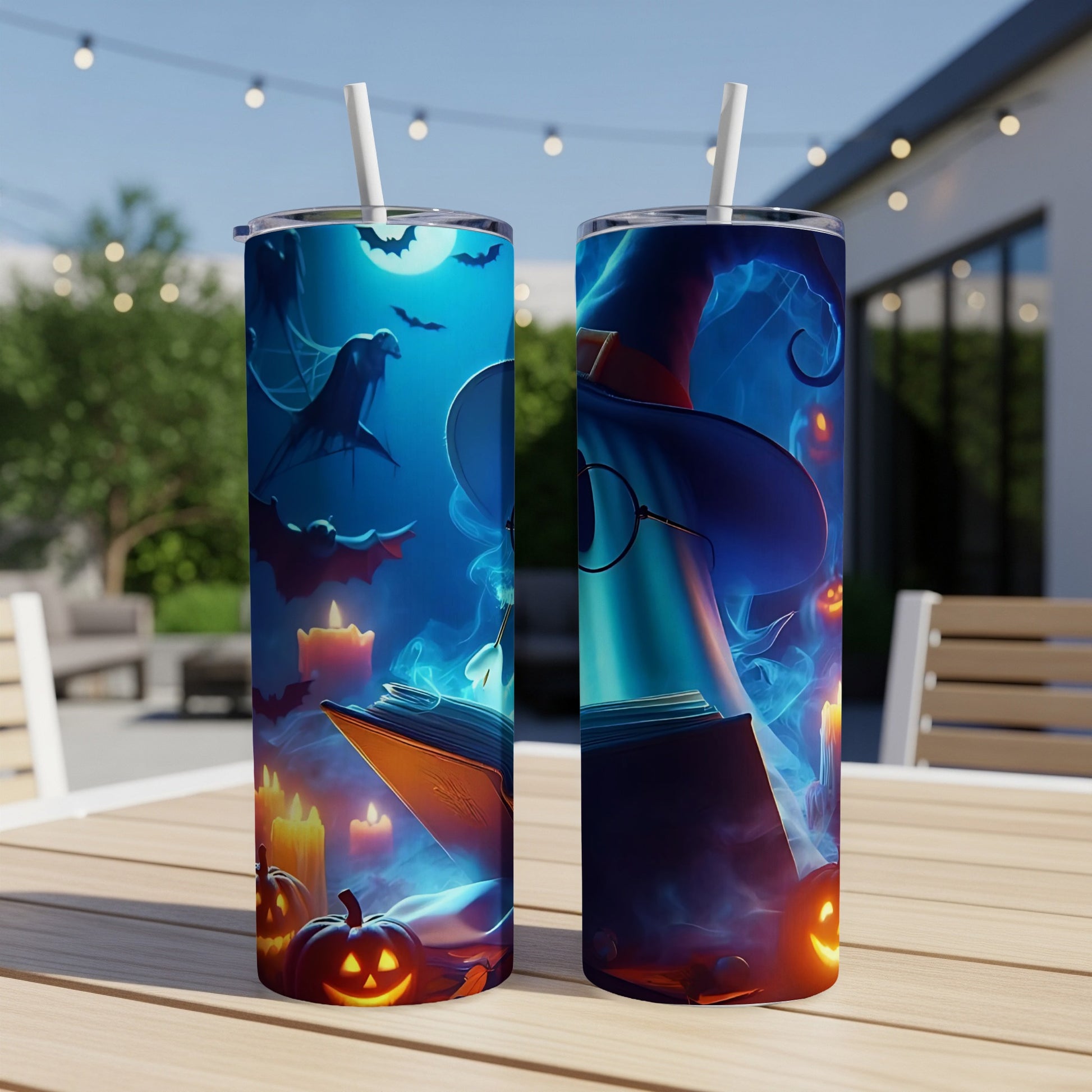 Two tumblers with a spooky Halloween scene of bats, pumpkins, candles, and a witch.
