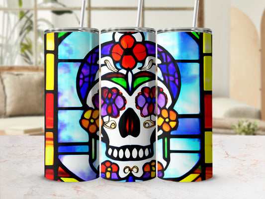 Stained glass skull tumbler with colorful floral designs.
