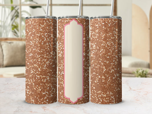 Three glitter tumblers with straw on a marble surface.