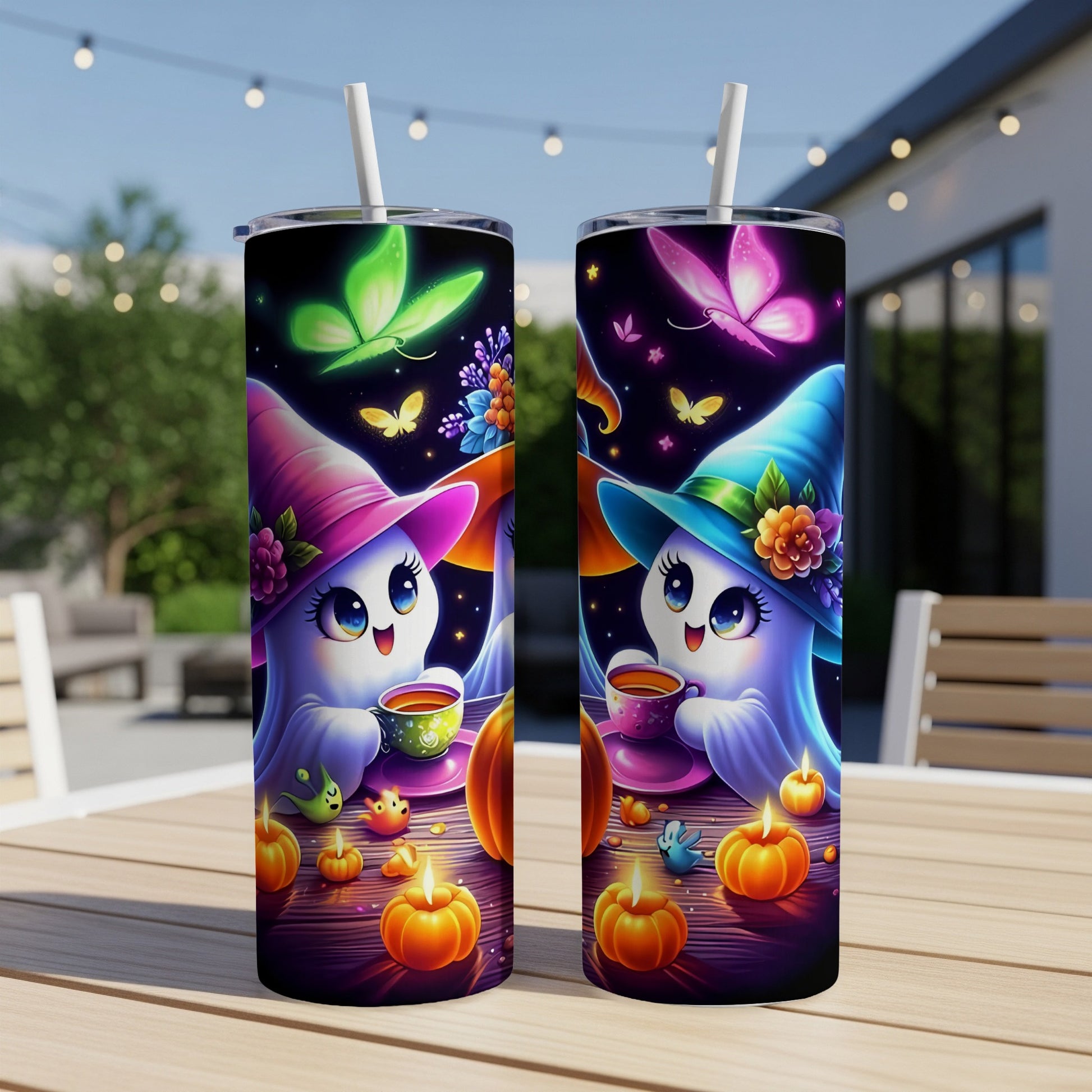 Two tumblers with cute ghosts in witch hats, butterflies, pumpkins, and candles.