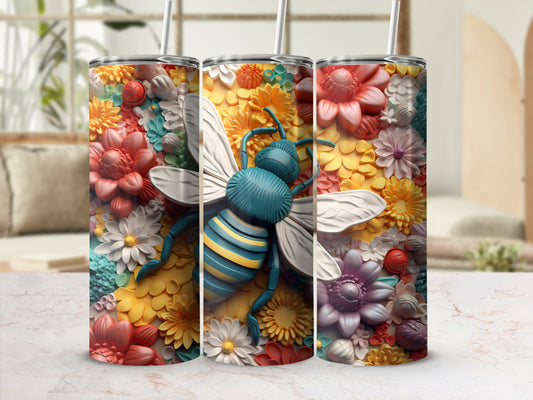Tumbler with a detailed bee surrounded by colorful, textured flowers.
